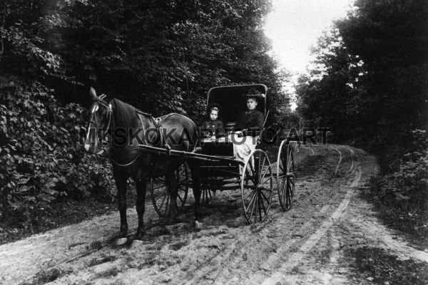 #15 Daughter and mother aboard their fine buggy