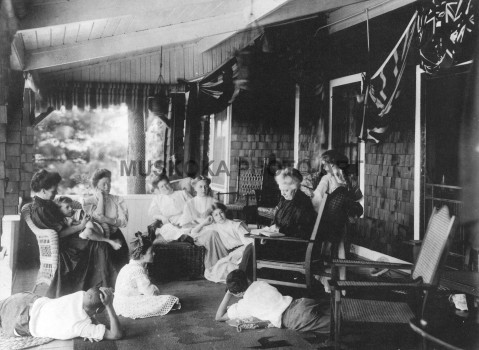 #16 Cottage life, 1905. Grandma reads to family
